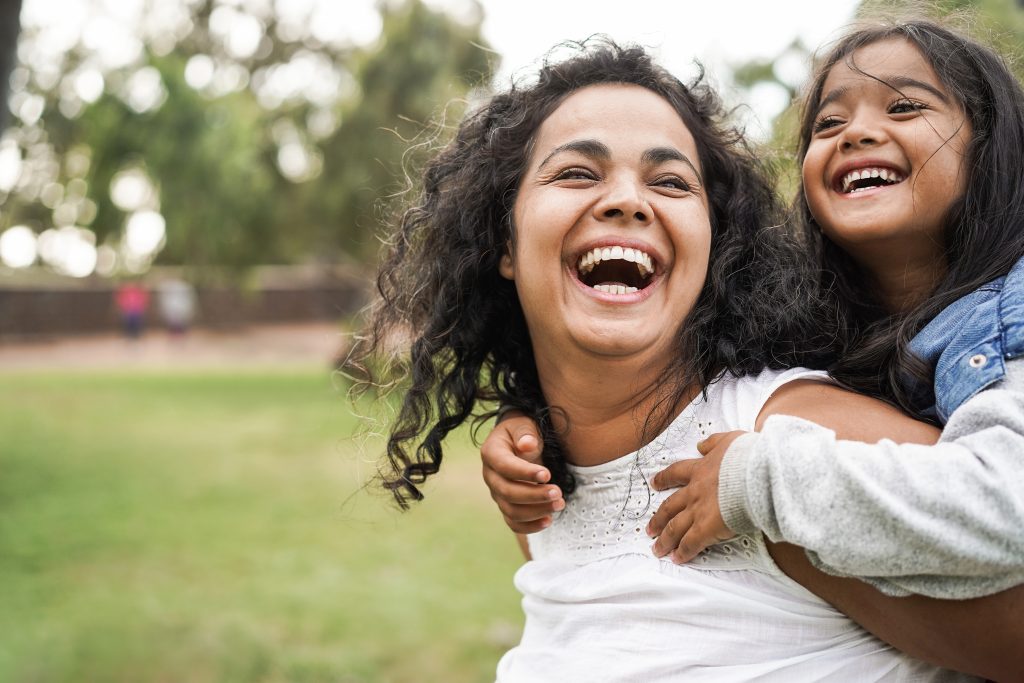 mum and daughter laughing